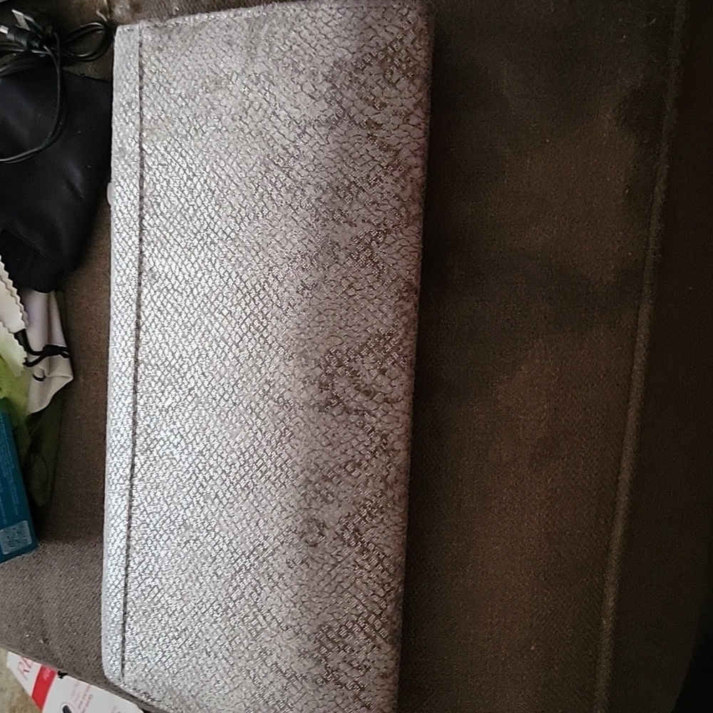Grey faux snakeskin clutch.
